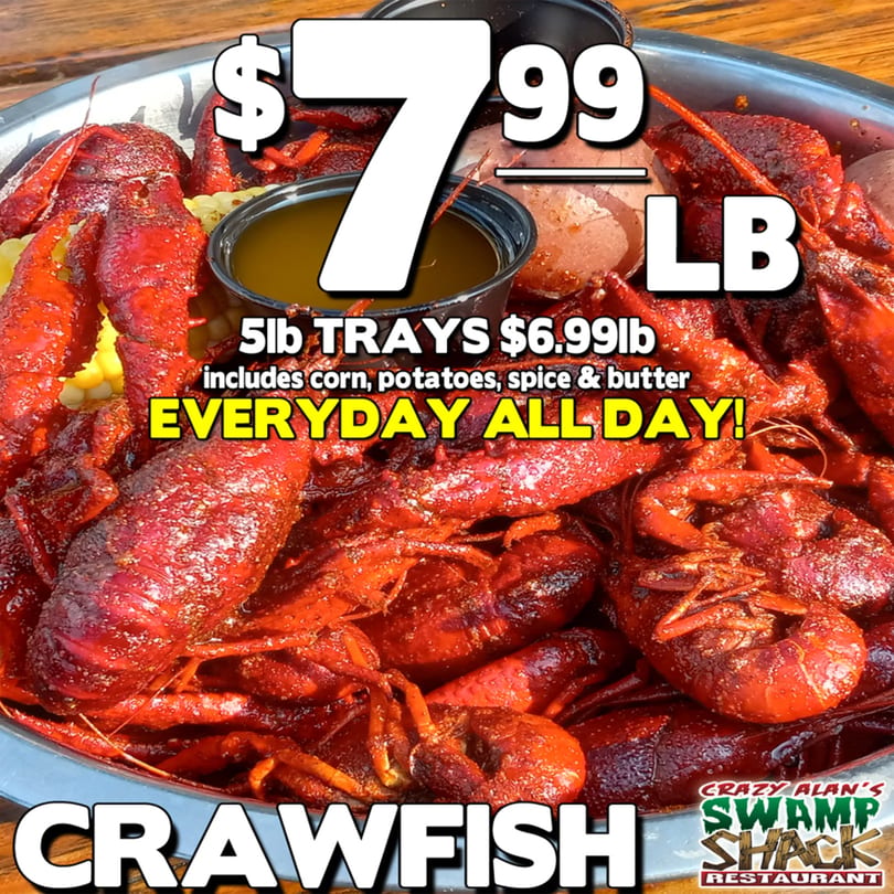 A large platter of Crazy Alan's Swamp Shack crawfish, corn, and potatoes with butter sauce.